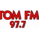  97.7 Tom