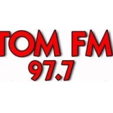  97.7 Tom